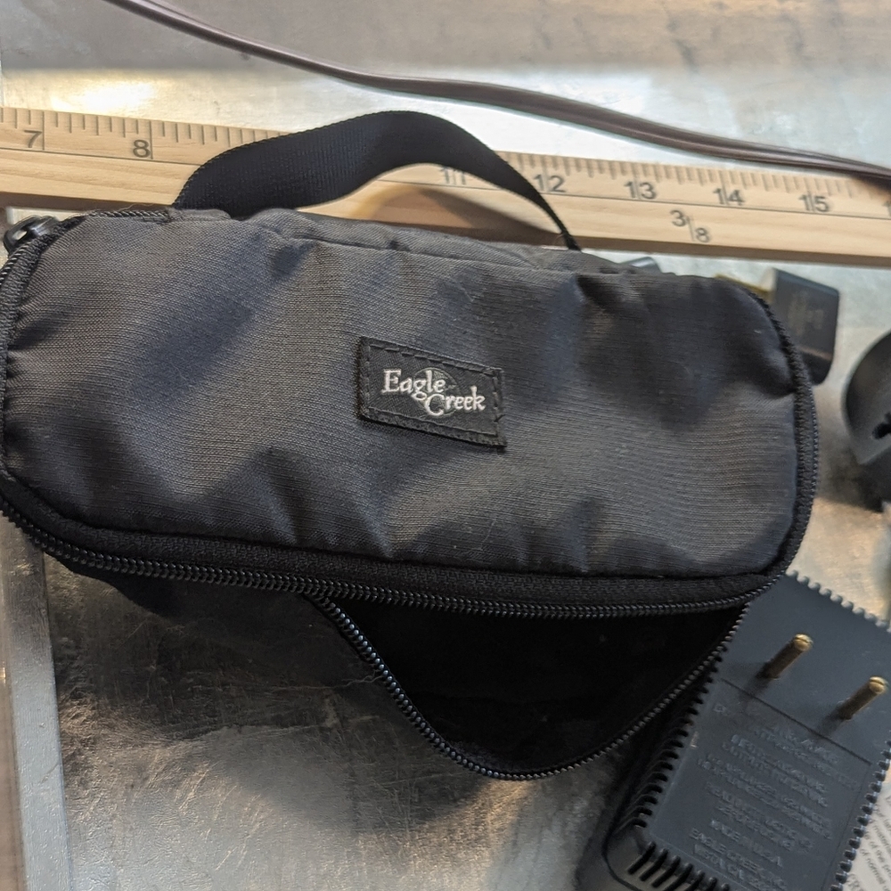 Eagle Creek Black bag Full Of International Plugs Converters Travel